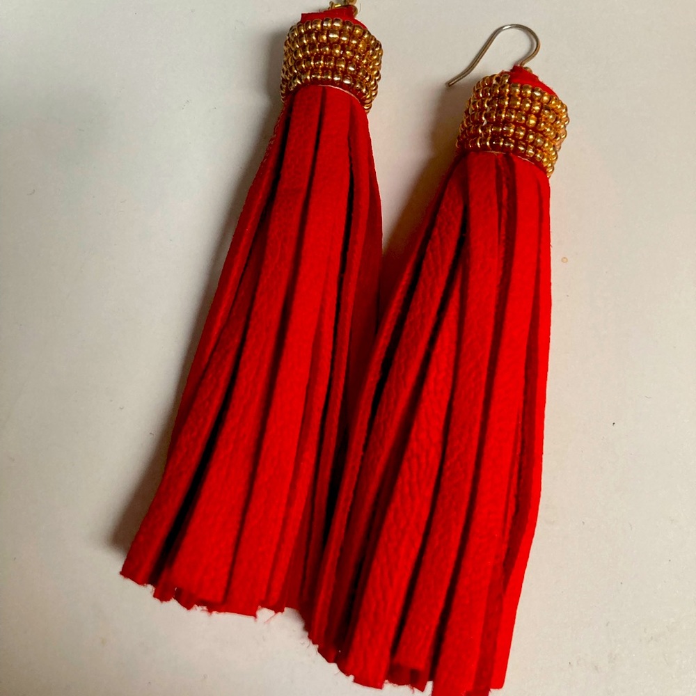 Stunning red tassel earrings. I love them but I am cleaning my closet.